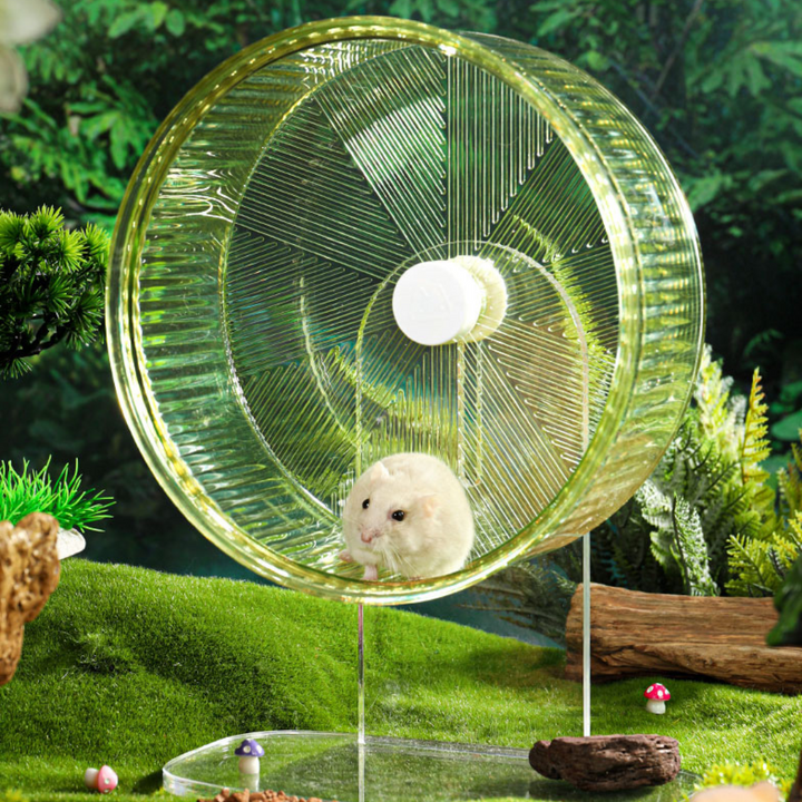 Hamster running on the Mini&Moe Silent Crystal Running Wheel in a habitat setup